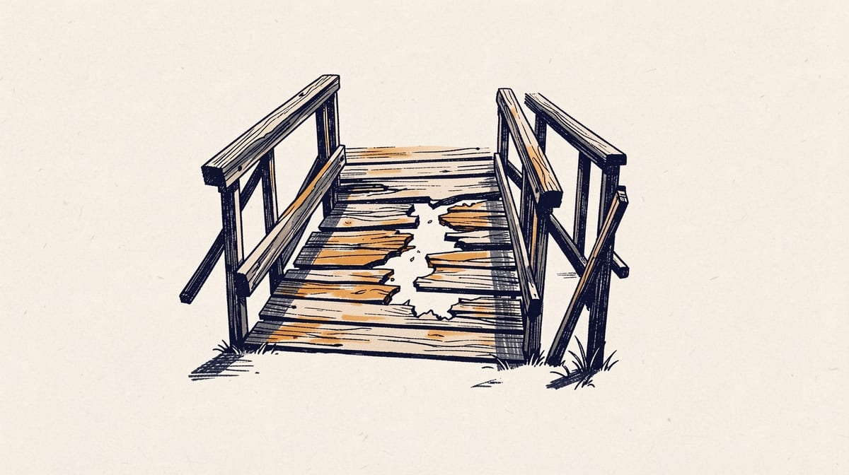 Wooden footbridge with one rotted plank splintering and creating a gap in the middle, showing deterioration over time.