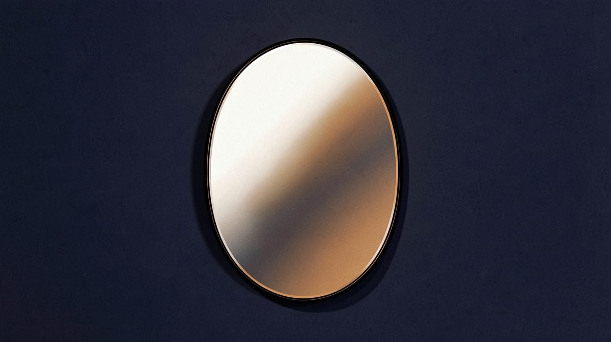 A polished mirror mounted on a wall reflects bright light without casting a shadow on the surface behind it.